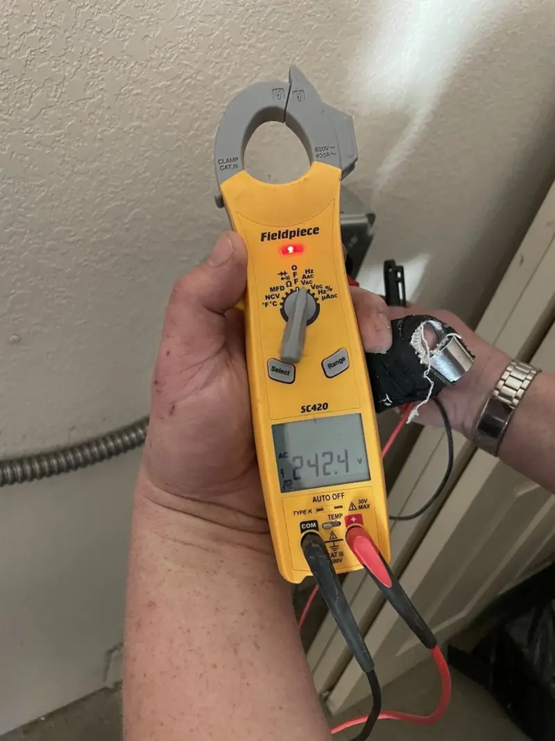 Voltage testing with clamp meter during Outlet Installation in Saugus